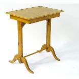 An early 20thC fruit wood side table with single frieze drawer,