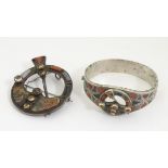 Scottish jewellery : A white metal bangle set with various hardstone agate and carnelian decoration