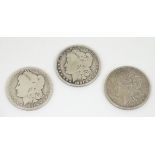 Morgan Silver Dollars: three American silver Morgan one dollar coins with the years 1891,