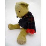 Teddy Bear : a mohair covered bear with a proud nose, hump backed, articulated arms and legs,