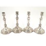 A set of 4 silver candlesticks hallmarked Birmingham 1910 maker Alexander Clark Manufacturing Co.