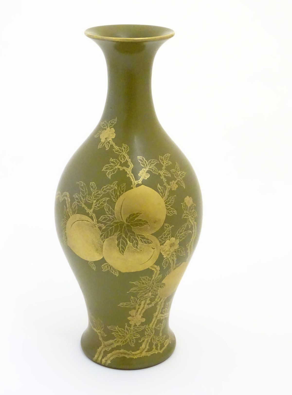 A Chinese tea dust glaze vase with gilt fruit, bat and branch decoration. Character marks under.