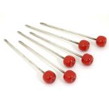 A set of 6 Vintage retro Sterling silver cocktail sticks surmounted by celluloid cherries.