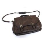 A late 20thC leather computer satchel with shoulder strap and various zip compartments,