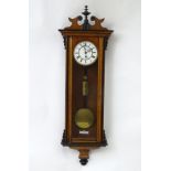 A late 19thC walnut cased Vienna regulator wall clock with 30 hour single weight movement,
