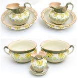 An Art Nouveau wash set, decorated with stylised lilies and gilt highlights,