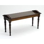 An Edwardian mahogany window seat / bench with applied mouldings to the top,