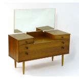 Vintage Retro: A British Avalon teak dressing table with angled top drawers and two long drawers on