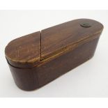 An oval wooden puzzle box with script to base 'To ope this box read well this verse.