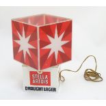 Advertising: A 'Stella Artois Draught Lager' electric table lamp of squared form, 10” high.