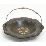 A Victorian papier mache cake basket with swing handle with gilt foliate decoration,