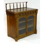 A mid / late 19thC oak Gothic cabinet, having a raised gallery above marquetry inlaid top,