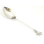 A Maltese silver spoon with twist handle surmounted by Maltese Cross finial 7" long