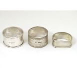 3 various silver napkin rings comprising an Art Deco example with engine turned decoration