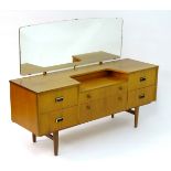 Vintage Retro: a mid Century teak dressing table having 6 drawers, bears remains of label verso,