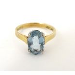 A 14ct gold ring set with oval aquamarine CONDITION: Please Note - we do not make