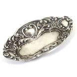 A small silver pin / bon bon dish with embossed decoration.