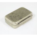 A white metal pill box / vinaigrette with engine turned decoration.
