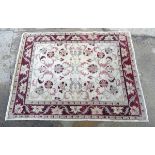 Carpet / Rug : a handmade Zeigler rug with buff central ground and burgundy border,