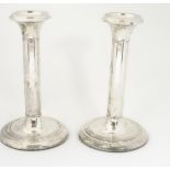 A pair of silver candlesticks hallmarked Birmingham