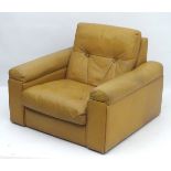 Vintage Retro :1960s/70s tan leather button back upholstered armchair,