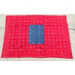 Carpet / Rug : A hand made flat weave wall hanging with central blue ground surrounded by a large