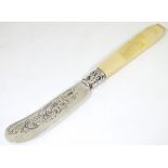 A Victorian silver butter knife with ivory handle.