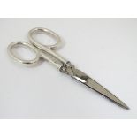 A pair of silver handled scissors Hallmarked Birmingham 1915 maker Synyer & Beddoes 4" long