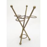 An umbrella / parasol stand of brass form surmounted by spherical finials. Approx. 18" high.