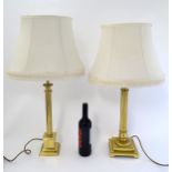 Lamps: two lacquer brass reeded column electric table lamps with squared stepped bases and matching