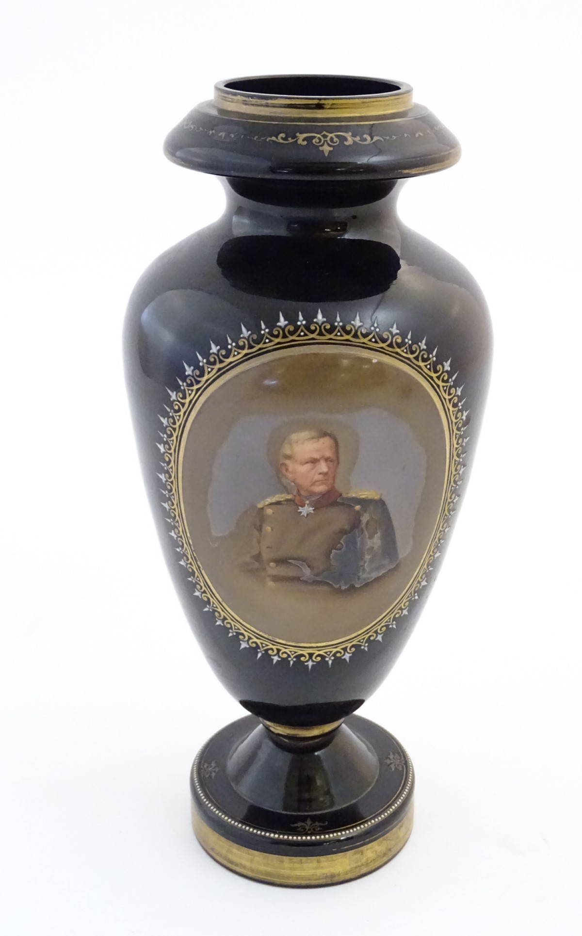 A black memorial glass vase decorated with a portrait of a high ranking German officer / military