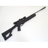 Airgun: a Crosman 'TR77' .177 (4.5mm) break-action air rifle, 18 1/2" barrel with muzzle brake.