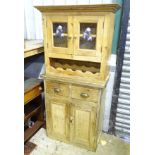 A pine kitchen unit with glazed top and wine rack CONDITION: Please Note - we do