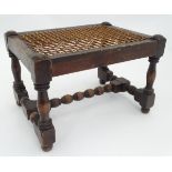 A rectangular foot stool with a woven seat CONDITION: Please Note - we do not make