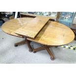 An extended oak pedestal table with 1 leaf and 2 pedestals CONDITION: Please Note -