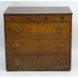 A late 18thC mahogany chest of drawers comprising two short over three long drawers with brass