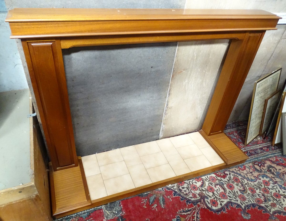 A mahogany fire surround and base CONDITION: Please Note - we do not make reference