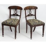 A pair of early / mid 19thC mahogany chairs,