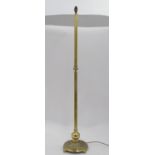 A brass standard lamp with decorative floral base CONDITION: Please Note - we do