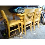 A satin finished pine kitchen table and 4 matching chairs CONDITION: Please Note -