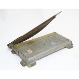 An old mid-century paper cutter also sometimes described as a paper guillotine by 'Prominent'