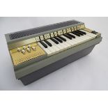 Musical Instruments: a Rosedale Electric Chord Organ 'Virtuoso Cortina', two-octave keyboard with A,