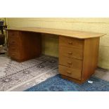 Vintage Retro: a signed Gordon Russell bespoke maple pedestal desk of bowed shape with two