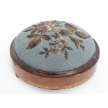 A Victorian walnut footstool of circular form with bead decoration CONDITION: Please