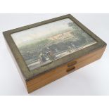A cigarette box with inset polychrome print of a landscape CONDITION: Please Note -