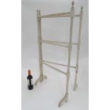 A painted towel rail CONDITION: Please Note - we do not make reference to the