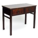 A 19thC Oriental hall table, of elm construction with two drawers and red painted finish, 42" wide,