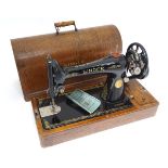 A cased Singer sewing machine CONDITION: Please Note - we do not make reference to