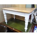 A pine farmhouse kitchen table with a waxed top and white painted base CONDITION: