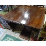An extending dining table with pad feet CONDITION: Please Note - we do not make